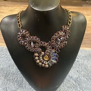 Necklace, purple, and gray, with gold tone trim.